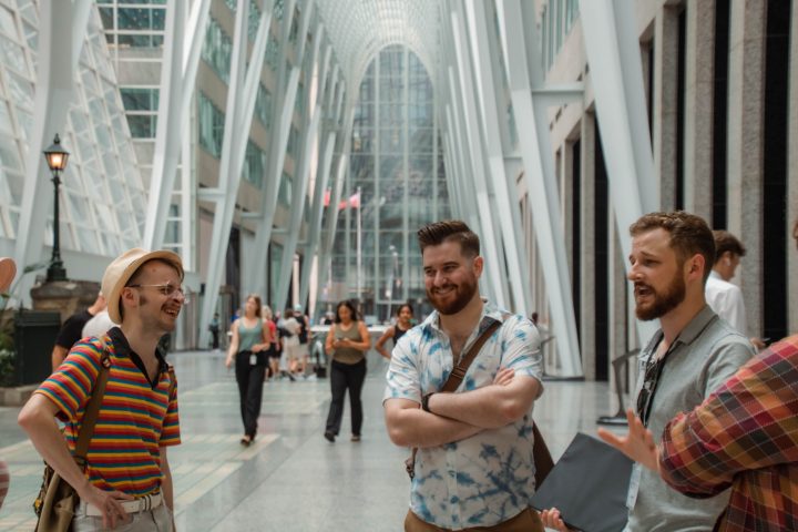 a group of people standing in front of a building